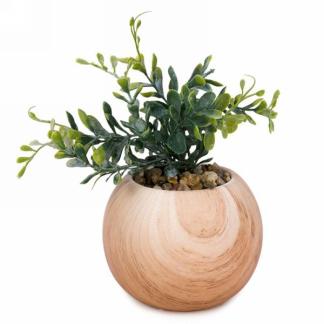 Artificial plant in wood-like pot